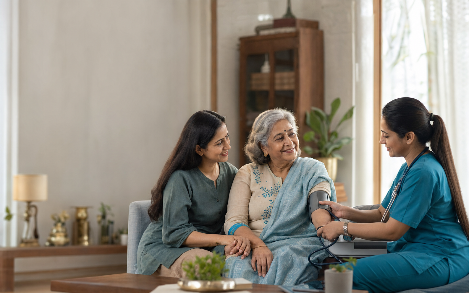 CuraMitra nurse caring for an Indian mother at home with her daughter nearby